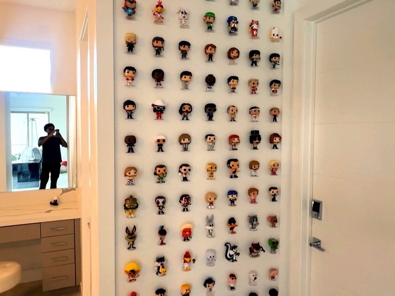 Custom floor-to-ceiling display wall, precisely mounted in a Las Vegas home
